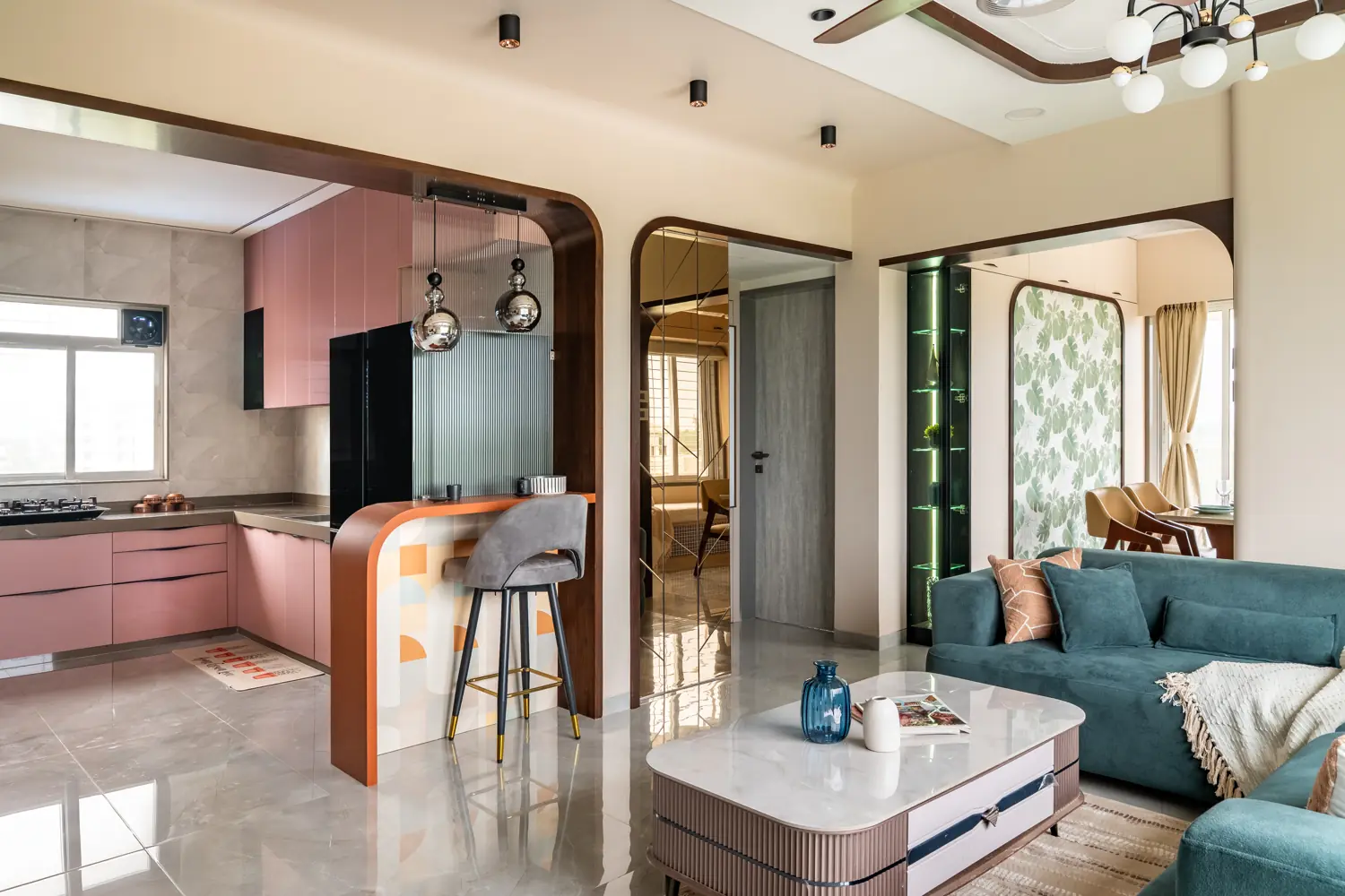 Open-plan living and kitchen seen through wooden arches
