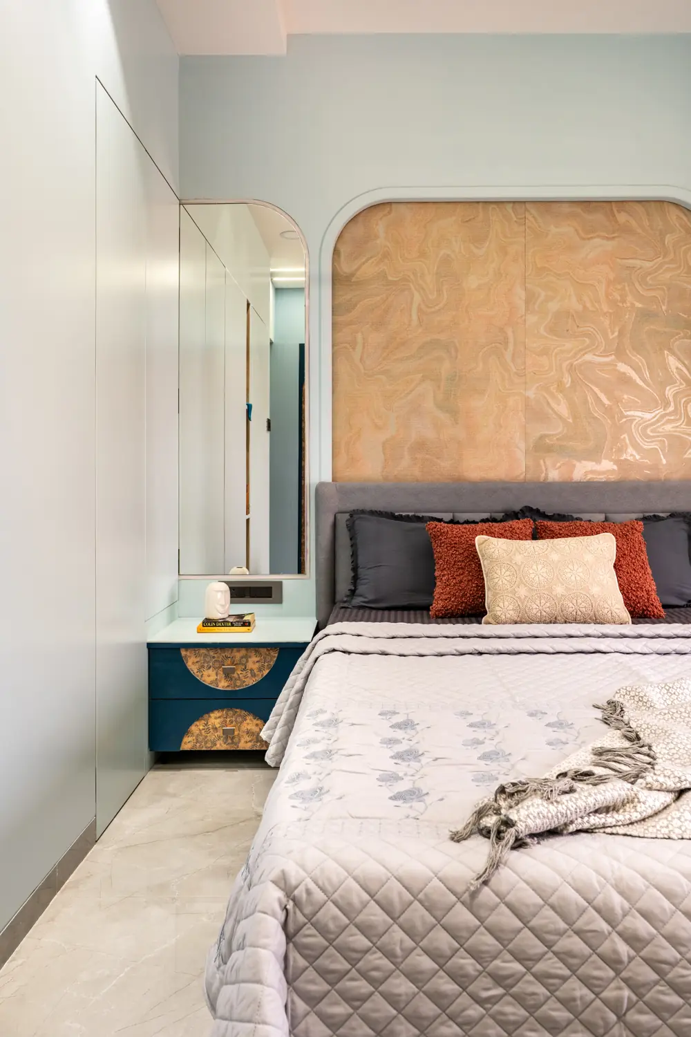 Navy headboard and gold arch, seen from the side